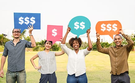 People holding signs with dollar symbols on them